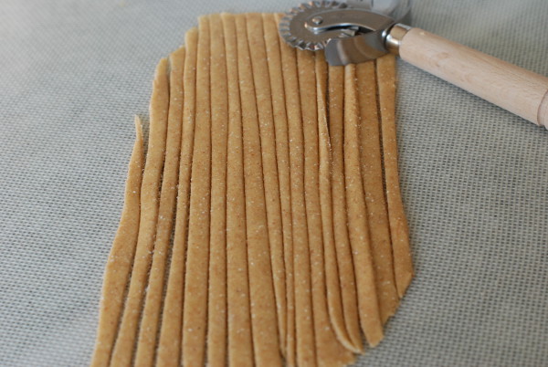 Cutting spaghetti from the pasta dough