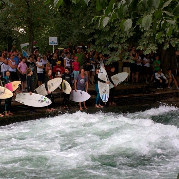 Watch surfers on the Eisbach in Englischer Garten during 24 hours in Munich Germany.