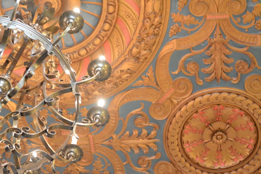 The ornate ceiling of the HOTEL DU PONT's lobby.