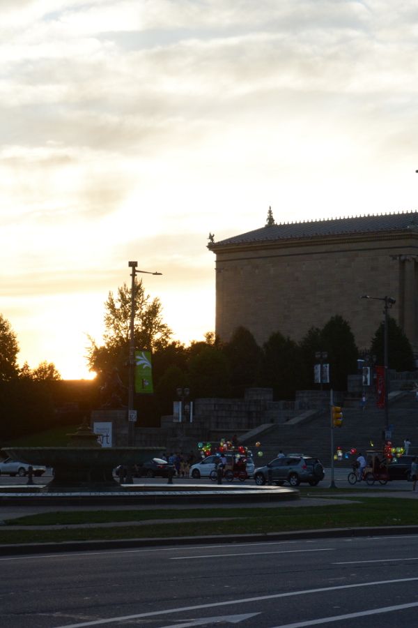 Cai Guo-Qiang: Fireflies pedicabs glide past the Philadelphia Museum of Art.