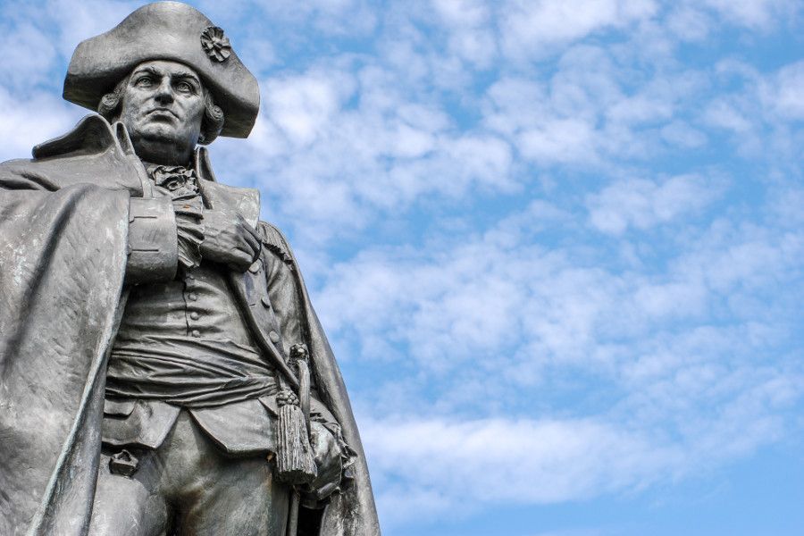 A statue of Baron von Steuben looks over meadows at Valley Forge National Historical Park.