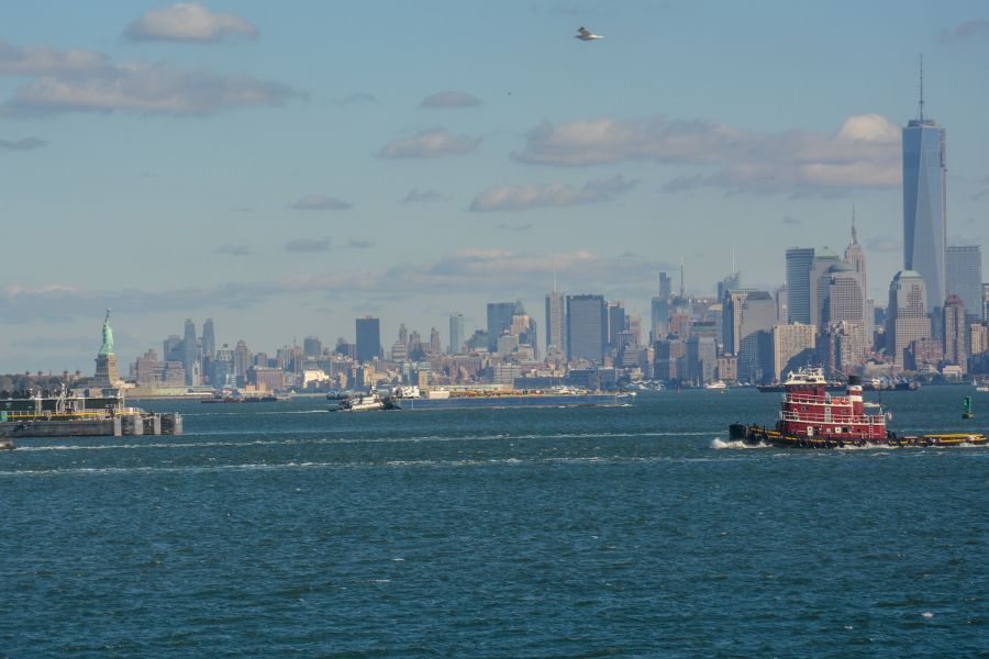 The Statue of Liberty and NYC skyline from the waterfront while cruising on the Staten Island Ferry is one of the great free things to do in New York City.