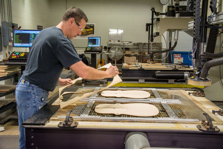 Cutting out guitar bodies at the Martin Guitar factory.