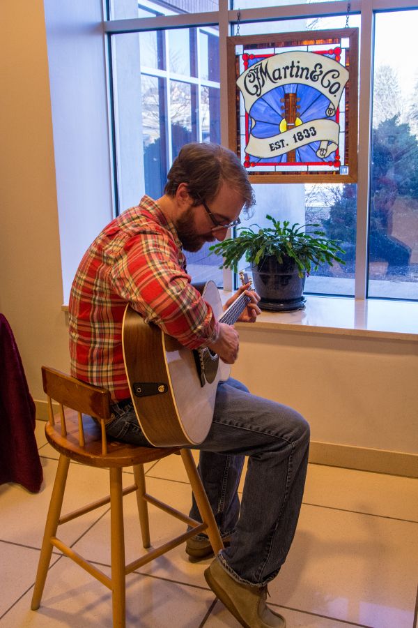 Playing a Martin Guitar.