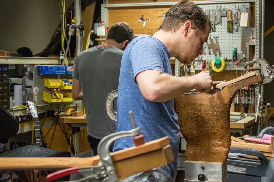 Shaping guitar necks at Martin Guitar factory.