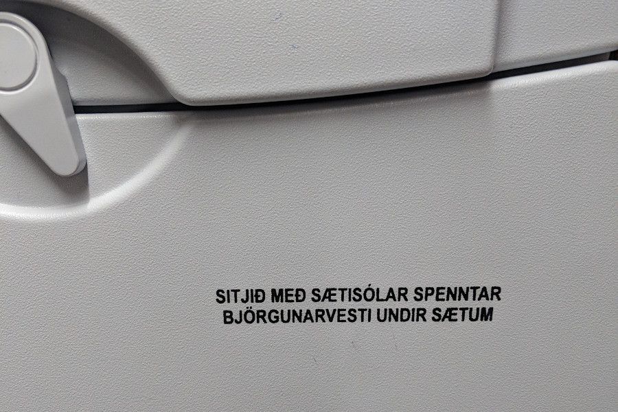 Icelandic writing on the tray table of an Icelandair flight.