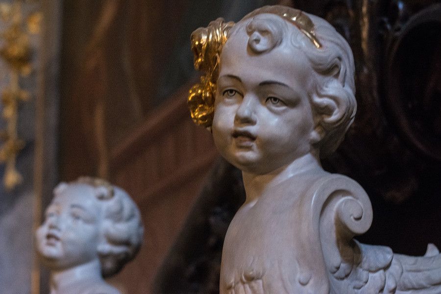 An angel head sculpture inside the Asamkirche in Munich, Germany.