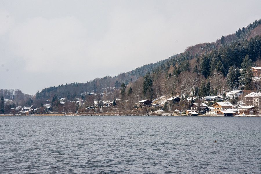 Houses on a hill seen across the Tegernsee lake.