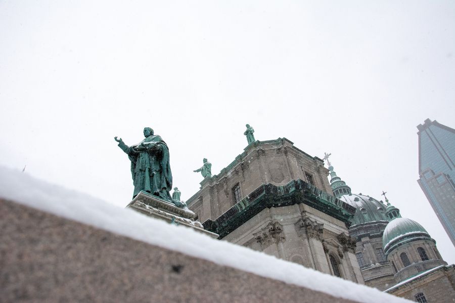 A view of the sculptures atop the Mary, Queen of the World Cathedral through the snow in Montreal, Canada.