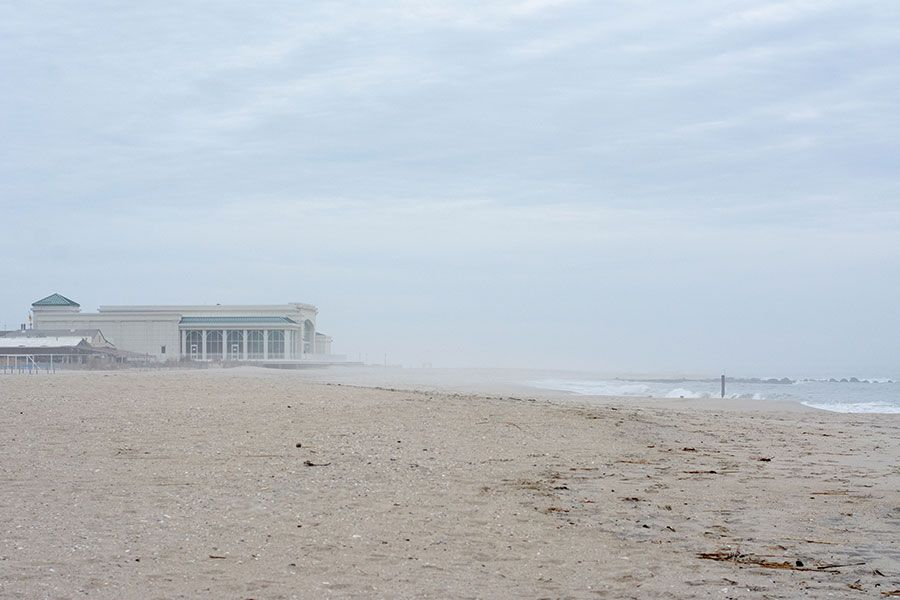 The Cape May Convention Hall in the distance on the empty winter beach.