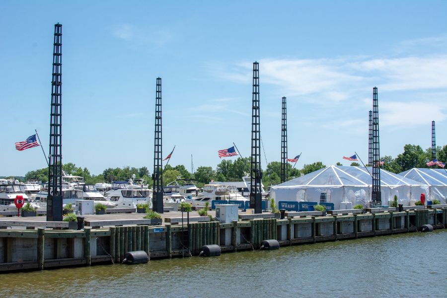 American flags line the walkway along a marina at the Washington waterfront.