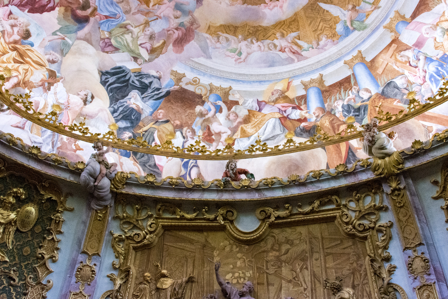 A plaster likeness of one of the Asam Brothers peers down at worshipers in the Kloster Weltenburg Church.