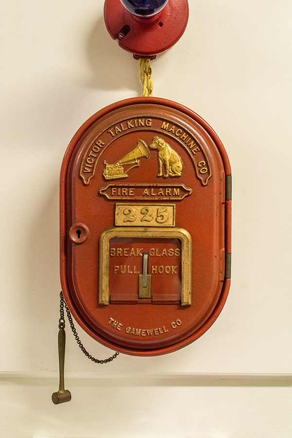 A fire alarm featuring the Victor Talking Machine Company logo at the Johnson Victrola Museum.