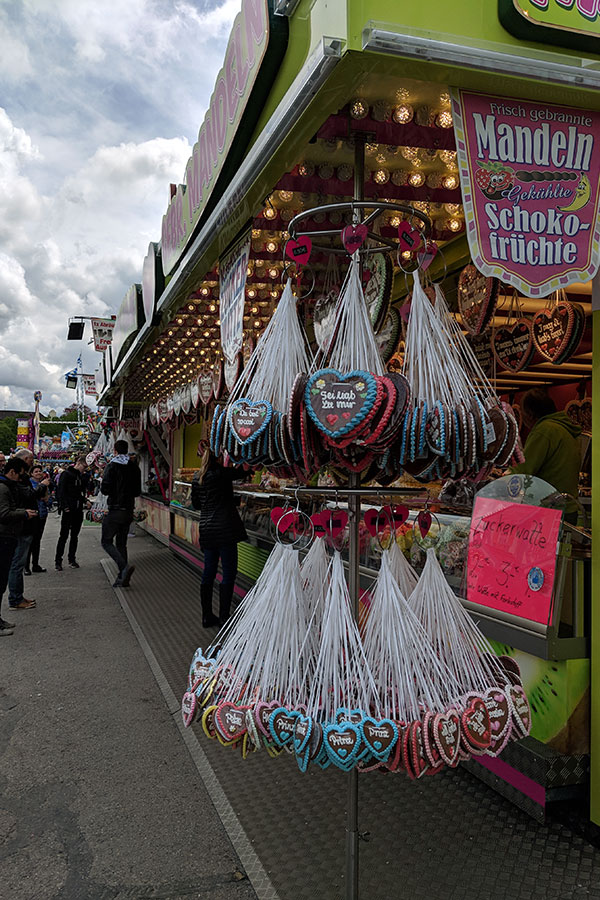 Lebkuchenherzen hang at a sweet stand at Munich Frühlingsfest.