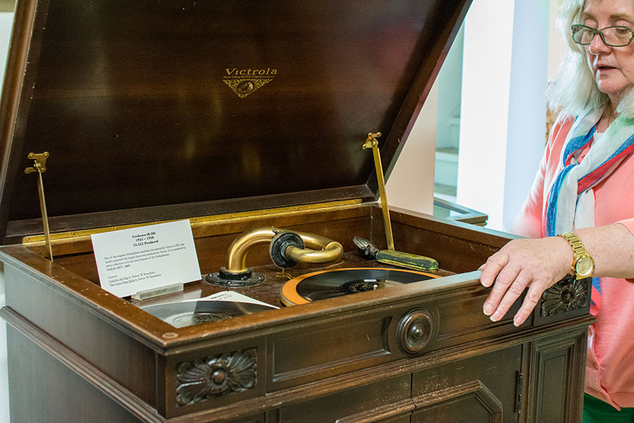 Examining a Victrola at the Johnson Victrola Museum.