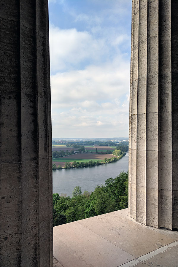 A view over the Danube River Valley from Donaustauf in between the columns of Walhalla.