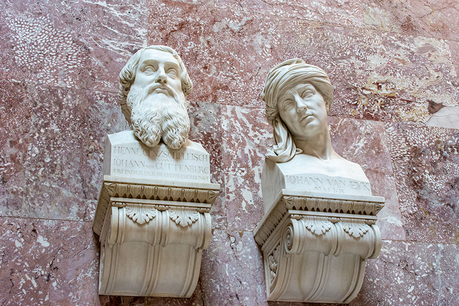 A close up of busts honoring Johann von Guttenberg and Johann van Eyk.