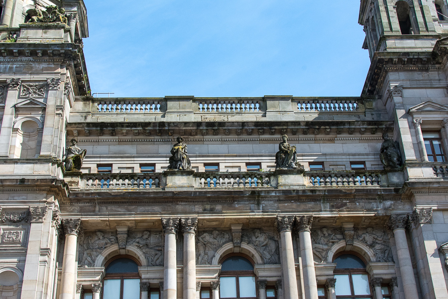 Statues decorate the architecture along the sides of the Glasgow City Chambers.