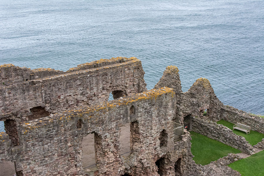 The ruins of Tantallon Castle sit along the sea.