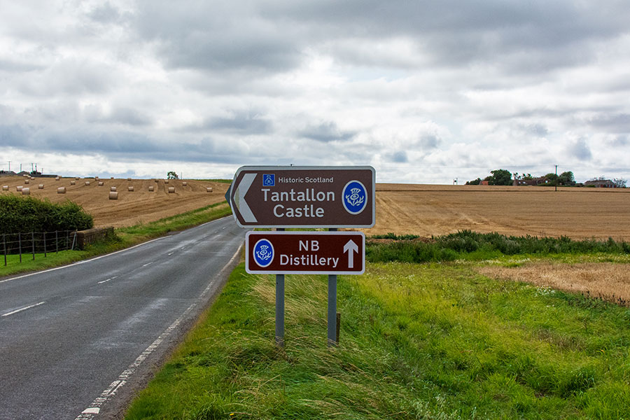 A sign points the way to Tantallon Castle along the road in East Lothian, Scotland.