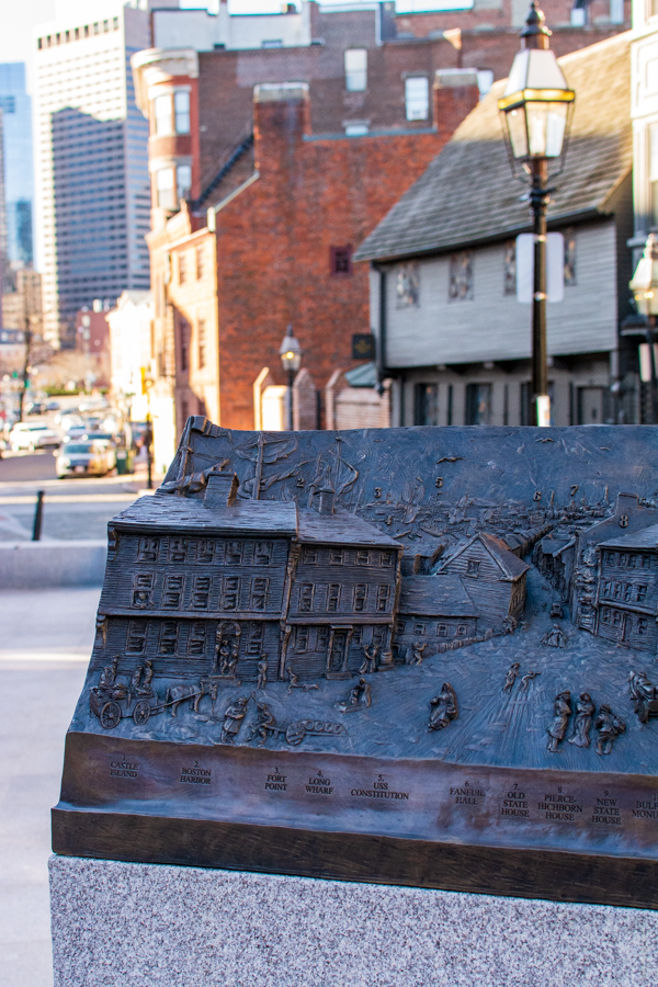 A monument outside the Paul Revere House imagines what the street looked like centuries prior.