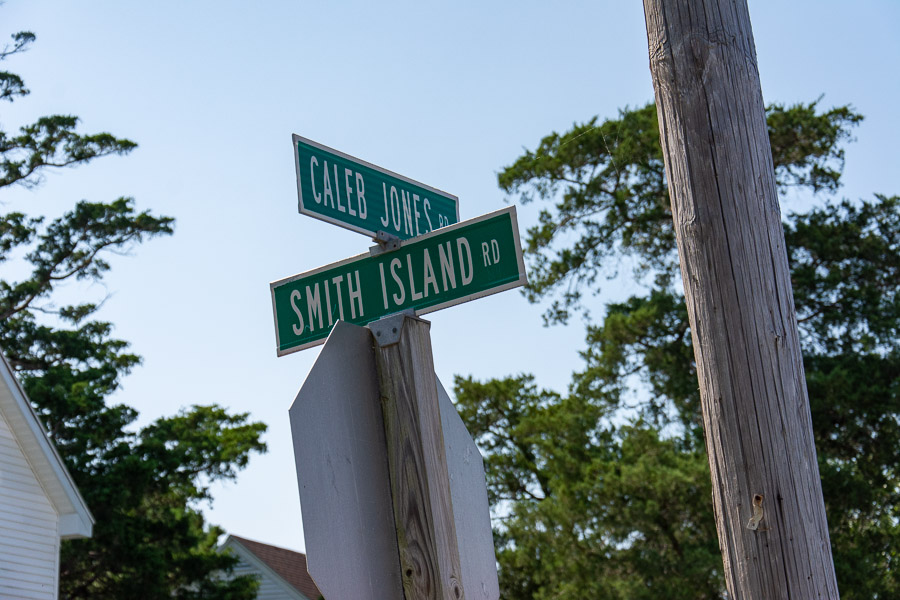 Street signs for Smith Island Road and Caleb Jones Road.