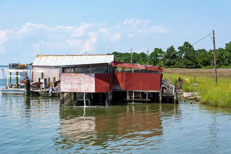 Buildings on stilts just above the water of the Chesapeake Bay.