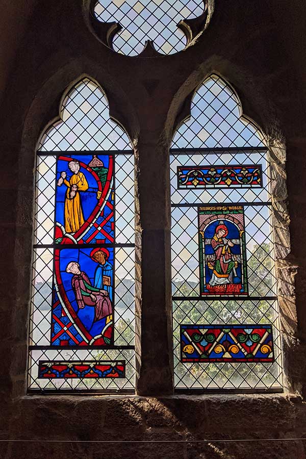 Stained glass windows in the Met Cloisters offer stunning views over the Hudson River.