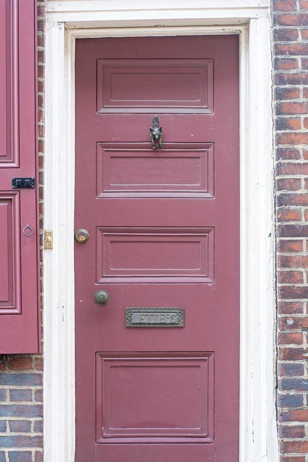 A fox door knocker is among the details of a home's door on Elfreth's Alley.