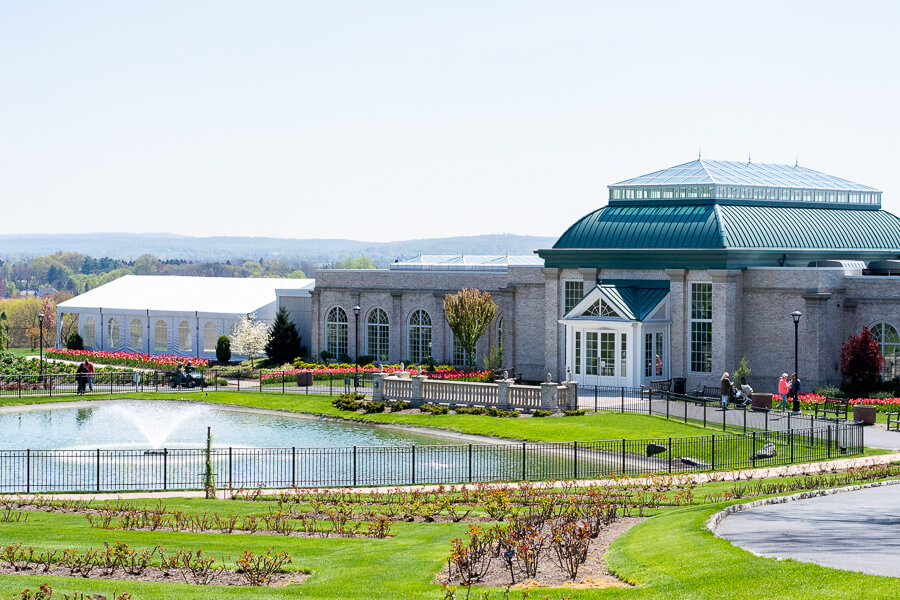 The conservatory and Swan Lake welcome visitors to Hershey Gardens.