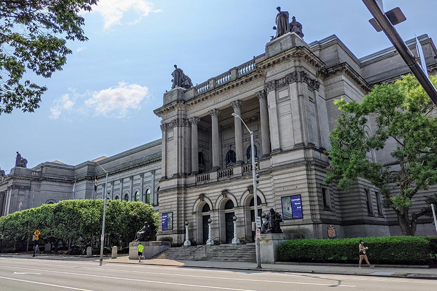 Notable sculptures adorn and surround the Carnegie Music Hall in Pittsburgh.