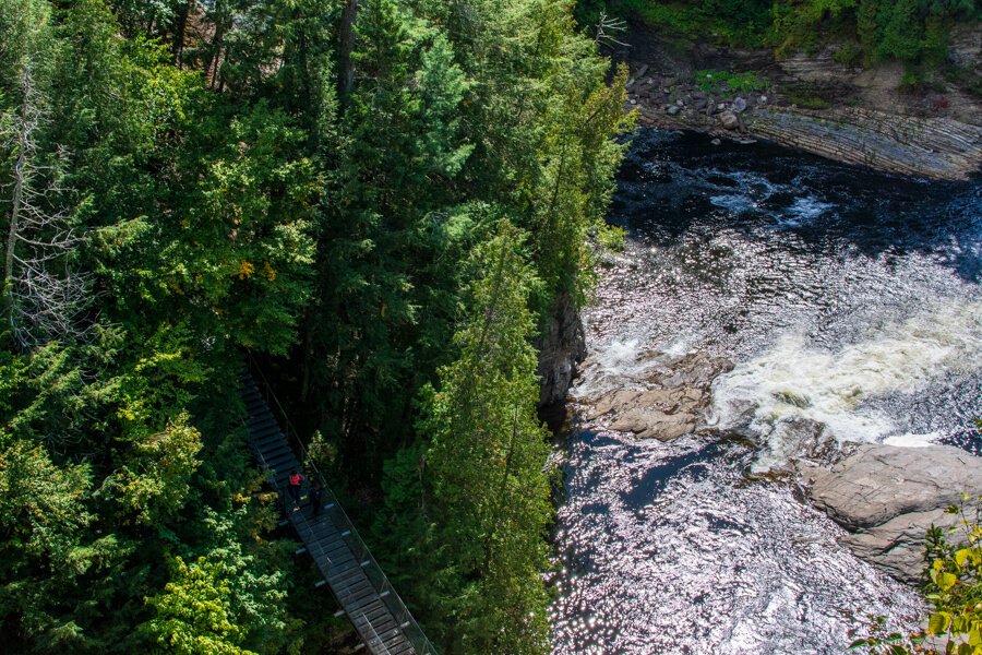 Looking down at the Saint Anne du Nord River and one of three bridges over the canyon.