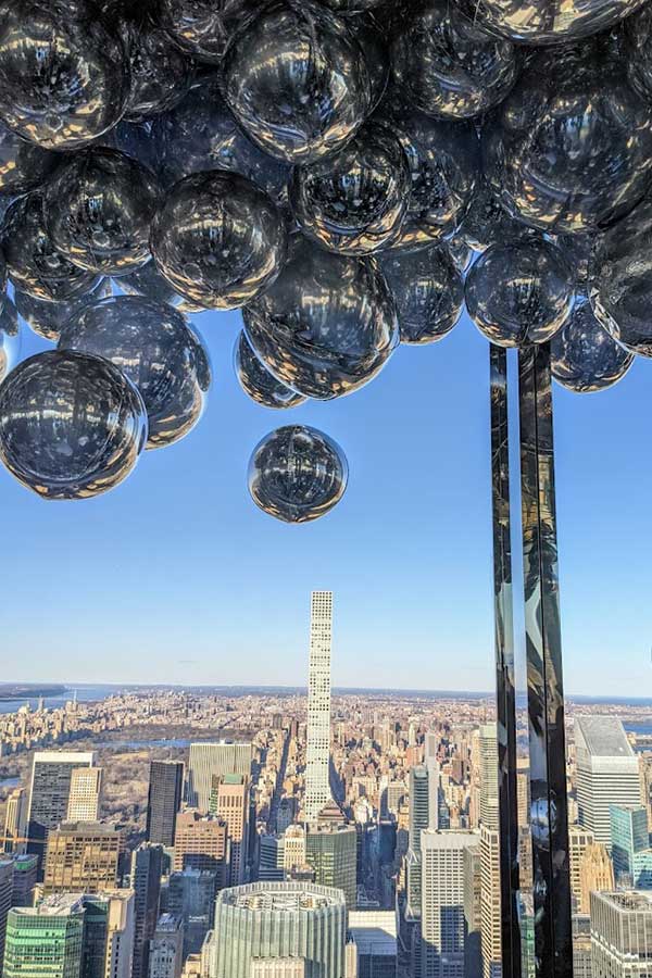 Balloons frame the view from the NYC observation deck Summit One Vanderbilt.