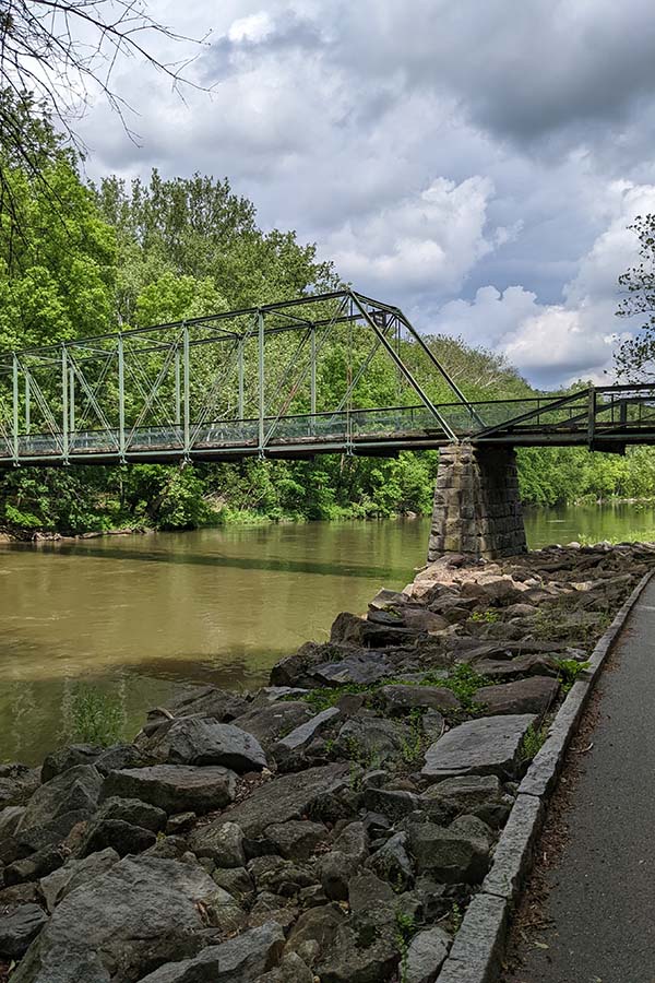 A bridge over the Brandywine River is visible along the scenic Hagley trail.