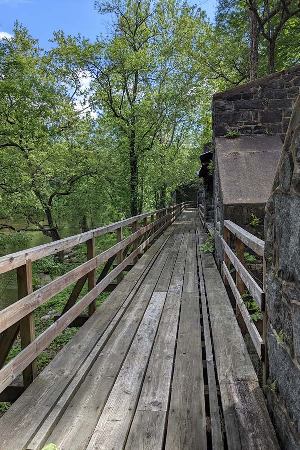 A walkway connects building along the Brandywine at the Hagley Museum and Library.