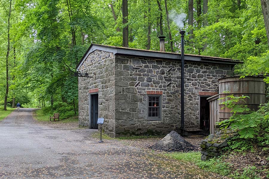 A stone building showcasing water power at the Hagley Museum.