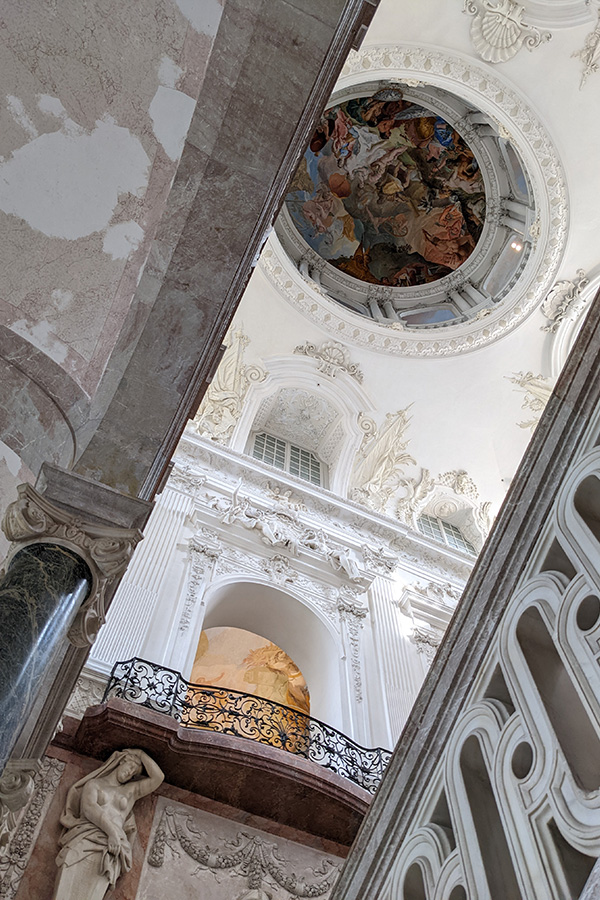 The grand stairway in Neues Schloss Schleissheim is topped with a painted dome.