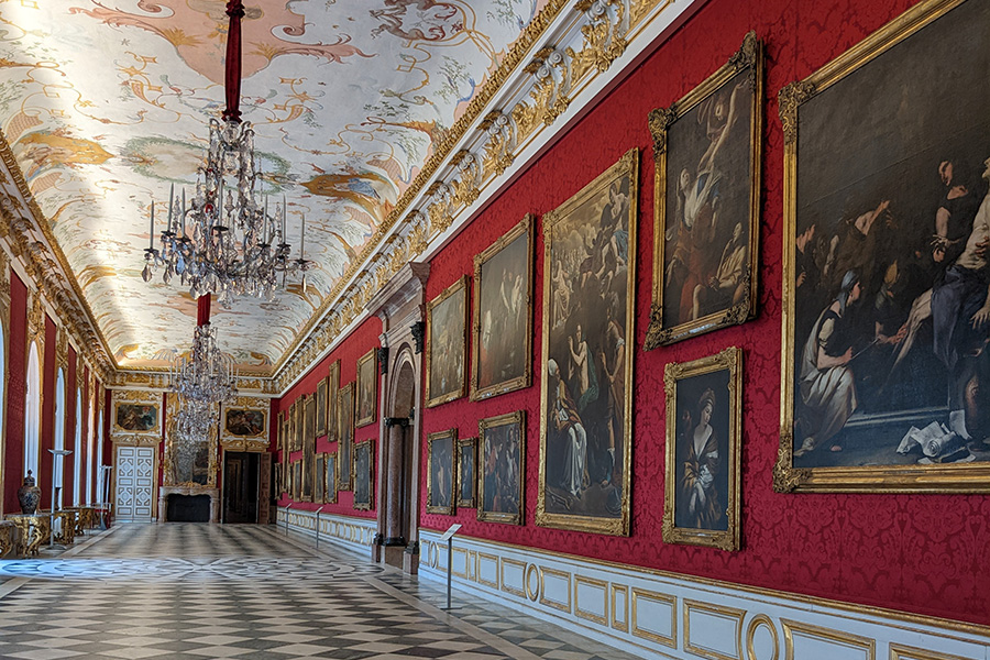 Paintings line the wall of the Large Gallery in the New Palace of Schleissheim Palace.