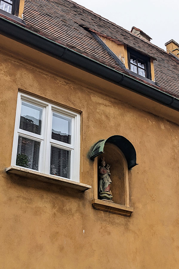 A religious statue in an alcove in the Fuggerei.