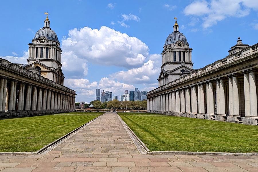 The buildings of the Old Naval College line the River Thames.