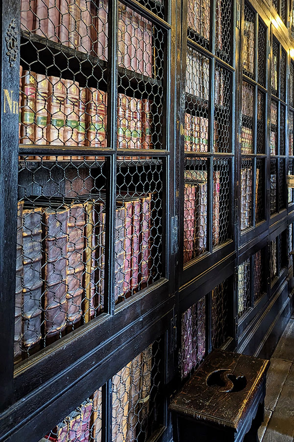 Books line shelves at Chetham's Library in Manchester.