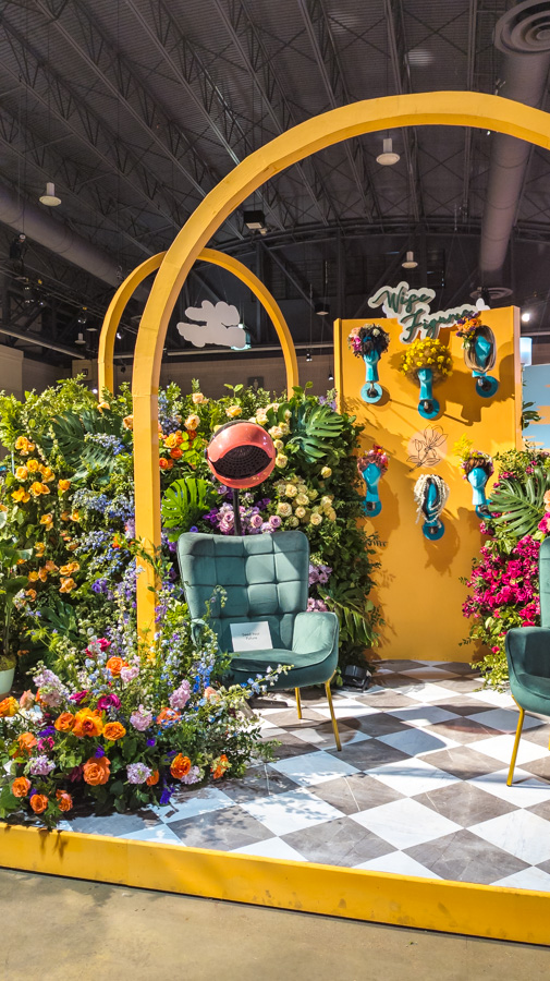 Black Girl Florists fill a salon with dozens of fresh flowers in bright, bold colors.