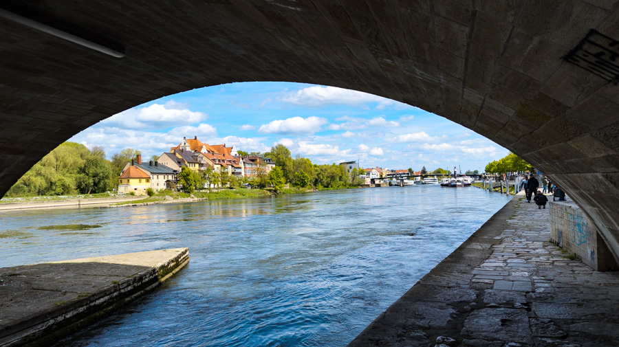 The Stone Bridge, Steinerne Brücke, frames a view of the Regensburg and the Danube River.