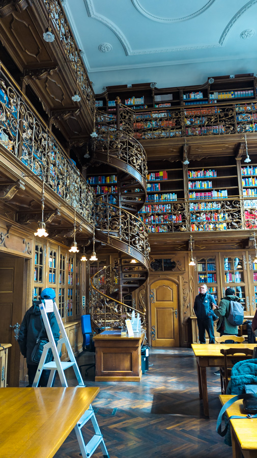 The Munich Law Library is a two-story room that is a working library.