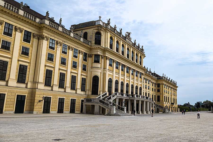 The back of Schönbrunn Palace overlooking formal gardens. and the palace park.